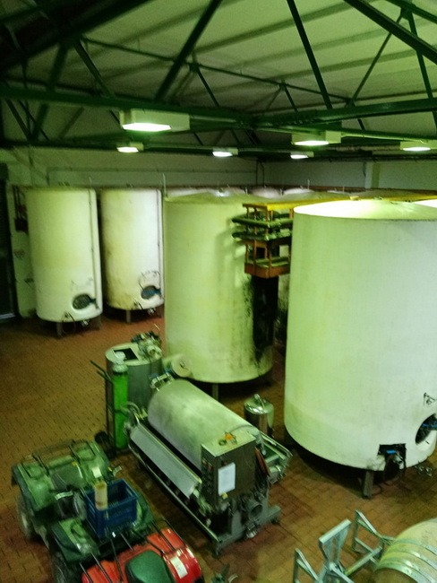 A picture of wine making tanks in a cellar